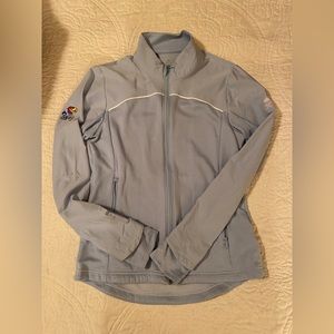 University of Kansas sky blue full zip-up. Close up on sleeves to indicate seam.